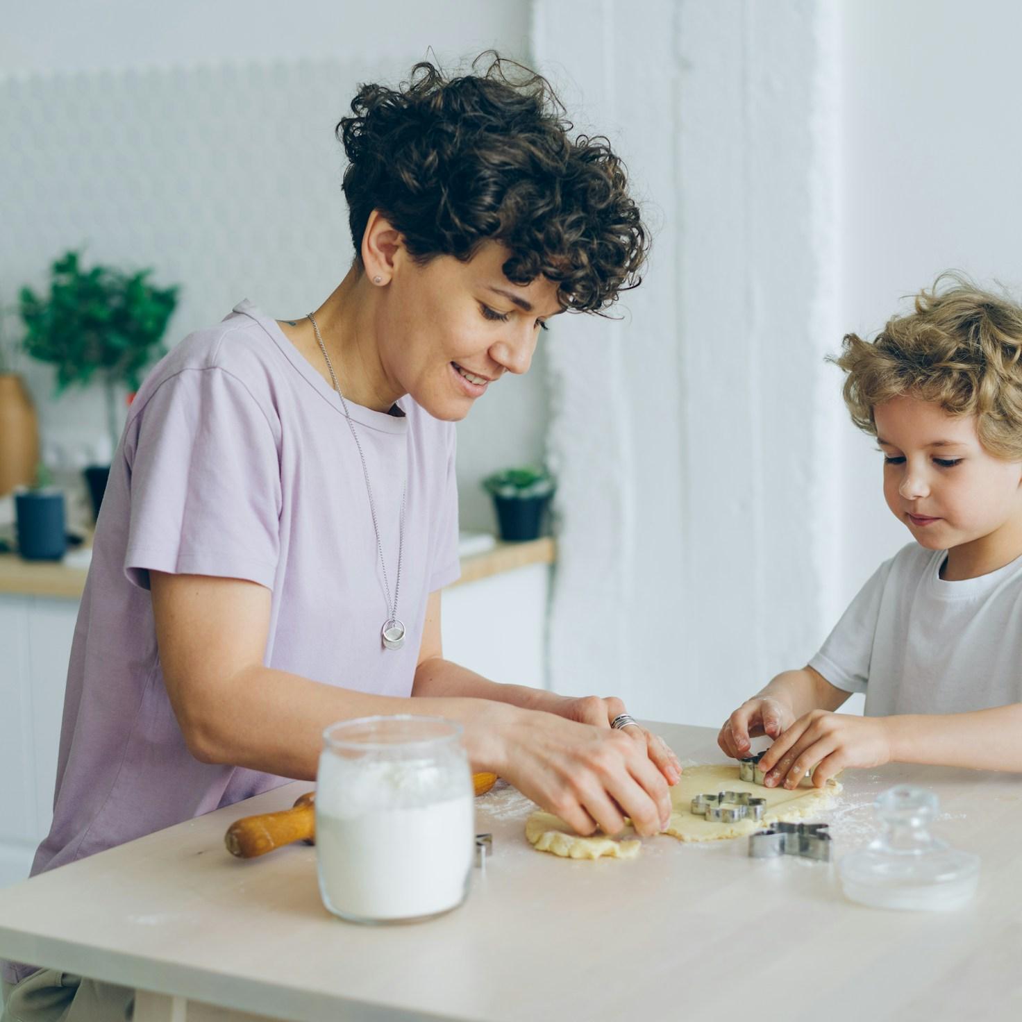 Community members collaborating in a modern kitchen space, sharing recipes and cooking techniques